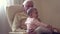 Happy grandfather holds a baby on hands indoors generation happiness concept slow motion