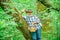 Happy Grandfather with mushrooms in busket hunting mushroom. Mushrooming in nature.