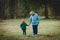 Happy grandmother with child walk in nature