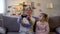 Happy grandmother excitedly playing video game, ignoring grandchild, prank