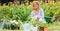 Happy grandmother gardening