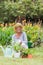 Happy grandmother gardening