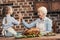 happy grandmother and granddaughter giving high five on thanksgiving after successful