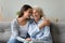 Happy grandmother and granddaughter touching foreheads, expressing love