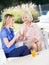 Happy Grandmother Showing Playing Card To