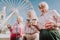 Happy grandmothers are drinking coffee on square