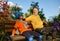 Happy grandparent and grandchild rest on bench after racing on roller skates