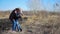 Happy grandson hugging grandmother over a nature