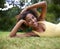 Happy, grass and portrait of black woman in nature for relaxing, calm and peace in park. Smile, garden and person laying