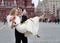 Happy groom holding beautiful bride