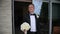 Happy groom is waiting for his bride. Young man waiting for his bride in outdoor wedding