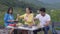 Happy with group of friends picnic with cooking food in summer, man and woman enjoy and fun camping journey adventure