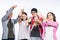 Happy group of friends with thumbs up isolated over a white background