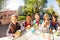 Happy group of international children drinking tea