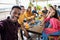 Happy group of multiracial people taking a selfie while having breakfast