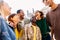 Happy group of Multiracial young friends having fun together in city street