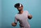 Happy guy playing online game with virtual reality glasses