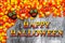 Happy Halloween greeting with candy corn and skulls