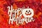 Happy Halloween greeting with fall leaves