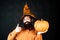 Happy Halloween - handsome man isolated. Happy Halloween. Smiling happy man with pumpkin. Young man with witch hat ready