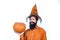 Happy Halloween - handsome man isolated. Portrait of Handsome man with pumpkin over isolated background. Halloween Man