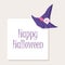 Happy Halloween holiday card with purple witch hat with spooky skull