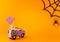 Happy halloween holiday concept. Halloween handmade paper decorations, spiders, spider web, ghosts in car on orange