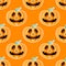 Happy Halloween jackolantern seamless pattern. Jack lantern with easy. Vector illustration isolated on orange background