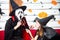 Happy Halloween party concept. Young man and woman wearing as vampires, witch or ghost celebrate the halloween festival