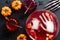 Happy Halloween party flat lay composition. Bowl with frozen hands, bloody drinks, strawberries and pumpkins, cocktails, bony