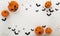 Happy Halloween party posters with spider web bat with pumpkins in cartoon illustration.