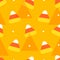 Happy Halloween pattern in polka dot with candy corns and triangles.