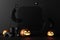 happy halloween promotional banner for party invitation background with halloween pumpkins glowing in the dark