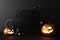 happy halloween promotional banner for party invitation background with halloween pumpkins glowing in the dark