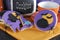 Happy Halloween purple and orange cookies with spiders and cookie jar - close up.