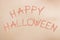 Happy Halloween sign, written in stitches on human skin