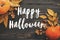 Happy Halloween Text on Beautiful Pumpkin with bright autumn lea