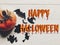 Happy halloween text flat lay. pumpkin with witch ghost bats and