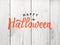 Happy Halloween Text Over Distressed Wood Background