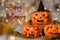 Happy Halloween! Three spooky orange pumpkins.