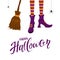 Happy Halloween with witches legs in purple shoes and broom
