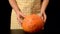 Happy Halloween. woman hands hold a pumpkin