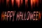 Happy Halloween written on bloody background