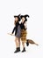 Happy Halloween, young asian women in witch hat and costume holding witch broom posing on white background