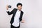 Happy handsome guy in suit, hat having fun with camera on white background. Excited, expressing true positive emotions