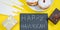 Happy Hanukkah. Jewish dessert Sufganiyot on yellow background. Symbols of religious Judaism holiday. Donuts, candles