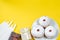 Happy Hanukkah. Jewish dessert Sufganiyot on yellow background. Symbols of religious Judaism holiday. Donuts, candles