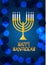 Happy Hanukkah lettering on bokeh background