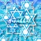 Happy Hanukkah with origami blue Magen David stars.