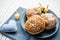 Happy Hanukkah. A traditional treat of doughnuts with David star and dreidel made from cheese and biscuit sticks. Blue fabric